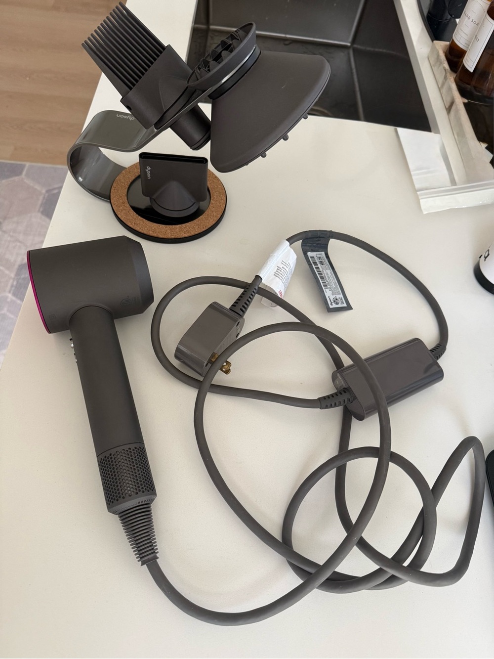 Dyson hair dryer with diffuser and cord in charcoal and magenta accents